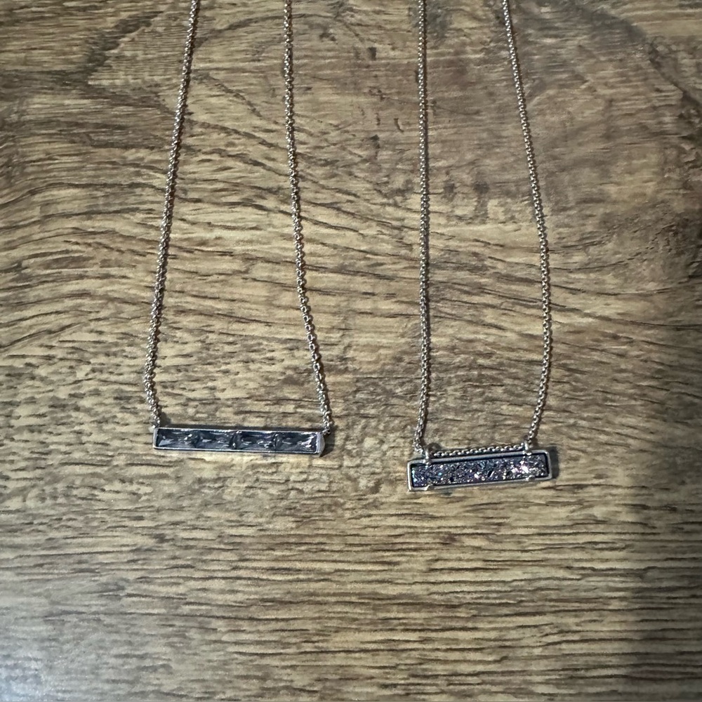 2 Kendra Scott silver bar necklaces.